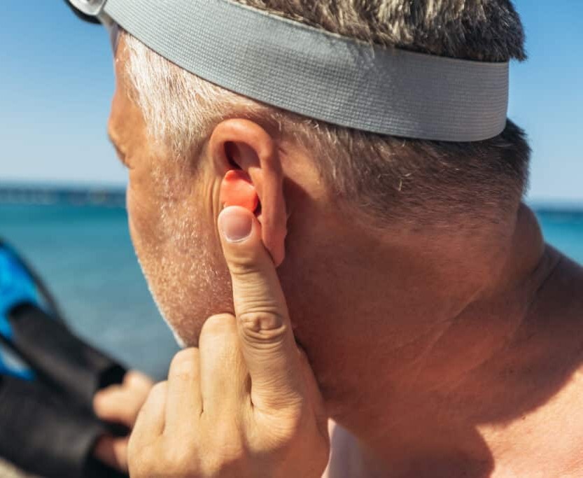 Custom-moulded earplugs for swimming & water sports made at Prestige Hearing